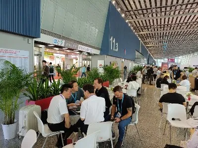 International buyers discussing wall panel sourcing with factory representatives at Canton Fair Guangzhou. International buyers discussing wall panel sourcing with factory representatives at Canton Fair Guangzhou.